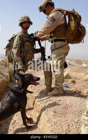 Sgt. Charles Nelson [left], a 27-year-old military working dog handler ...