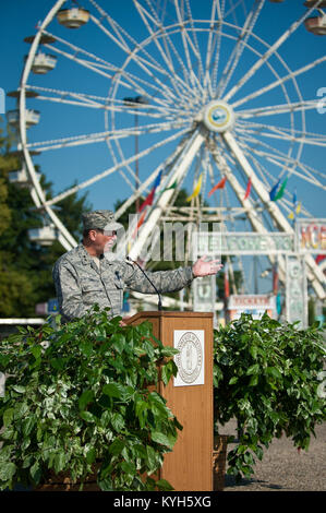 Maj. Gen. Edward W. Tonini, adjutant general of the Commonwealth of Kentucky, speaks to audience members during a ceremony kicking off Military Appreciation Day at the Kentucky State Fair in Louisville on Aug. 20, 2012. Tonini presented Harold Workman, president and CEO of the state fair board, with a proclamation on behalf of Gov. Steve Beshear during the event. (U.S. Air Force photo by Maj. Dale Greer) Stock Photo