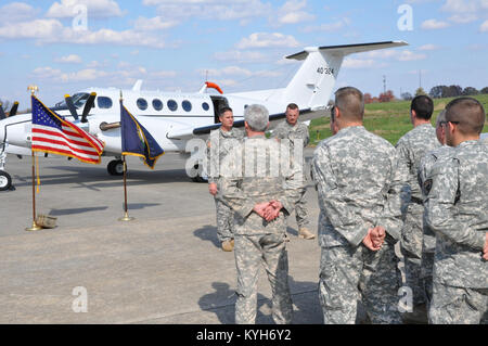 Chief Warrant Officer Five Stephen Hunnicut, commander of Detachment 11, Operational Support Airlift Command based out of Frankfort, Ky., gets promoted at Capital City Airport, Frankfort, Ky. Oct. 25, 2012. (photo by Capt. Stephen Martin, Kentucky National Guard Public Affairs) Stock Photo