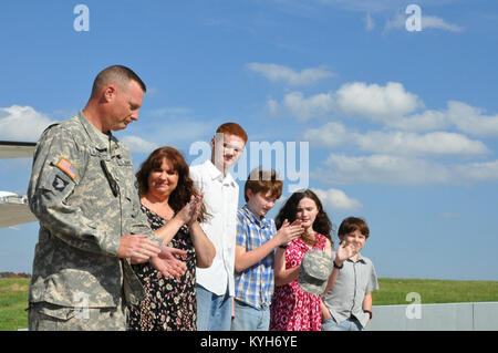 Chief Warrant Officer Five Stephen Hunnicut, commander of Detachment 11, Operational Support Airlift Command based out of Frankfort, Ky., gets promoted at Capital City Airport, Frankfort, Ky. Oct. 25, 2012. (photo by Capt. Stephen Martin, Kentucky National Guard Public Affairs) Stock Photo