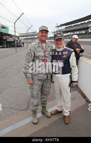 INDIANAPOLIS MOTOR SPEEDWAY, IN (November 19, 2012)-- Dr. Pearse Lyons, founder and president of Alltech, stands with Maj. Gen. Edward Tonini, Kentucky's adjutant general, prior to Dr. Lyon's tandem Indycar racing experience.  The ESGR Civic Leaders' Program included a C-130 flight to Camp Atterbury to watch Kentucky Guard Troops in training, a Blackhawk flight to the Indy500 Motor speedway to receive an Indy-tandem ride in a National Guard car, and key briefings from the ESGR officials. (Photos by Lt. Col. Kirk Hilbrecht, Director of Public Affairs, Kentucky National Guard) Stock Photo