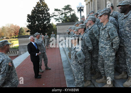 Kentucky Governor, Steve Beshear and the Adjutant General, Maj. Gen. Edward W. Tonini, laugh with new Kentucky Guard recruits on the steps of the State Capitol in Frankfort, Ky., Nov. 20, 2012. (Kentucky National Guard photo by Sgt. Scott Raymond) Stock Photo