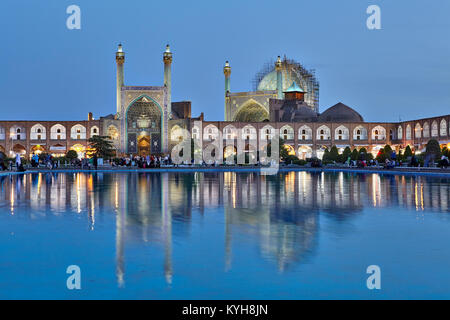 Isfahan, Iran - April 23, 2017: Evening view of the Safavid Shah mosque with night illumination and reflection in the water of a pond, Nagshe Jahan Sq Stock Photo