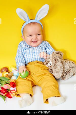 Happy baby boy with bunny ears Stock Photo