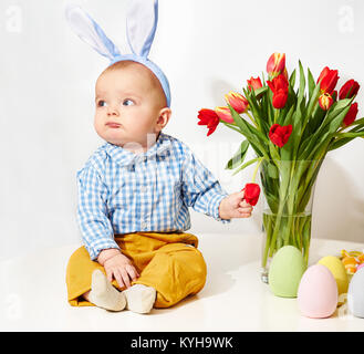 Funny baby boy with bunnies ears Stock Photo