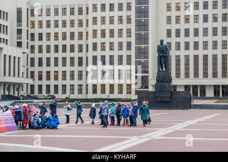 Children posing at the Independence Square, in front of the Lenin monument and the House of Government as background. Minsk, Belarus. Stock Photo