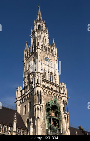 Clock tower of the New Town Hall (Neues Rathaus) in Munich, Germany. As the carillon plays figures dance on the facade of the Neo-Gothic building. Stock Photo