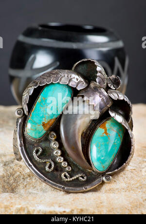 Antique Navajo silver and turquoise bear claw cuff. Stock Photo