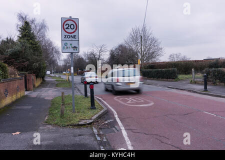 A 20 mph speed limit zone on Church End Lane in Tilehurst, Reading outside Moorlands Primary School is designed to make it safe for children to cross. Stock Photo