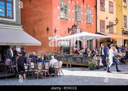 Stockholm busy sidewalk cafes in the picturesque historic neighborhood of Gamla Stan, or Old Town. The area is a popular destination for visitors Stock Photo