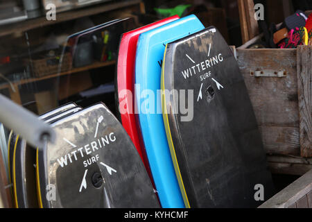 A group of Wittering Surf products pictured outside the Wittering Surf Shop in East Wittering, West Sussex, UK. Stock Photo
