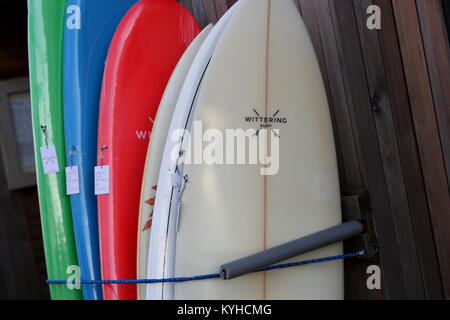 A group of Wittering Surf products pictured outside the Wittering Surf Shop in East Wittering, West Sussex, UK. Stock Photo