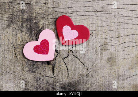 Two hearts on the old wooden floor. Stock Photo