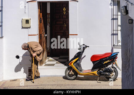 Elderly mand a  motorbike in Arcos de la Frontera in Andalusia, Spain Stock Photo