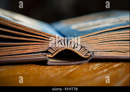 Closeup of rustic ancient book photo album with hard ornamental leather