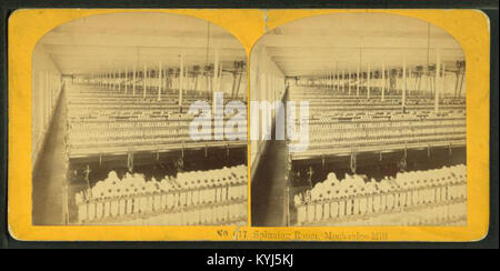 A spinning room in a 19th-century mechanics mill, displaying industrial textile machinery, workers, and the production environment during the period. Stock Photo