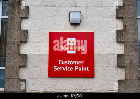 Royal Mail plaque on the wall of a local post office indicating Customer Service Point. Stock Photo