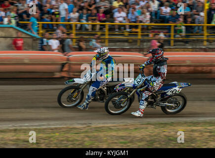 Rivne, Ukraine - 29 August 2015: Unknown riders overcomes the track at the Open Cup Speedway to the day of the city Rivne Stock Photo