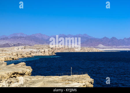 Rocky coast, Sinai mountains and the Red Sea in the Ras Muhammad National Park. Stock Photo