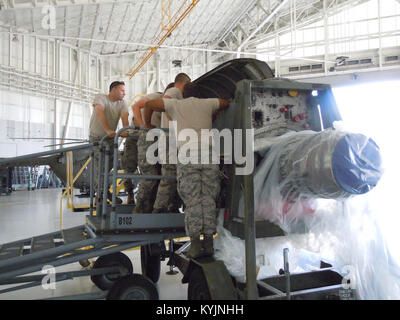 A Kentucky Air National Guard member works on a C-130 Hercules engine at the Air National Guard Combat Readiness Training Center in Gulfport, Miss., on June 18, 2013, as part of a week-long course called Maintenance University. The course was created by the Kentucky Air National Guard's 123rd Maintenance Group. (U.S. Air National Guard photo by Col. Ken Dale) Stock Photo