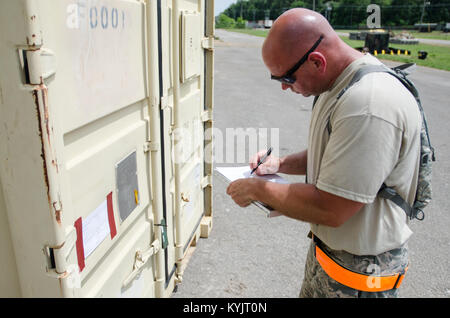 Staff Sgt. Kevin Freese, an aerial porter for the Kentucky Air National Guard’s 123rd Contingency Response Group, makes a cargo manifest for transportation to a staging area called the forward node during Capstone '14, a homeland earthquake-response exercise at Fort Campbell, Ky., on June 18, 2014. The 123rd CRG is joining with the U.S. Army’s 688th Rapid Port Opening Element to operate a Joint Task Force-Port Opening here from June 16 to 19, 2014. (U.S. Air National Guard photo by Master Sgt. Phil Speck) Stock Photo