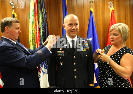 Lt. Col. Jerry Morrison, commander of the 149th Maneuver Enhancement Brigade is promoted to the rank of colonel during a ceremony in Frankfort, Ky., July 9, 2014. (U.S. Army National Guard photo by Staff Sgt. Scott Raymond) Stock Photo