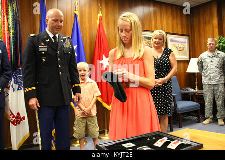 Lt. Col. Jerry Morrison, commander of the 149th Maneuver Enhancement Brigade is promoted to the rank of colonel during a ceremony in Frankfort, Ky., July 9, 2014. (U.S. Army National Guard photo by Staff Sgt. Scott Raymond) Stock Photo