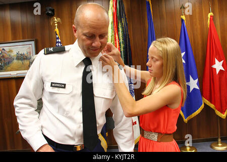 Lt. Col. Jerry Morrison, commander of the 149th Maneuver Enhancement Brigade is promoted to the rank of colonel during a ceremony in Frankfort, Ky., July 9, 2014. (U.S. Army National Guard photo by Staff Sgt. Scott Raymond) Stock Photo