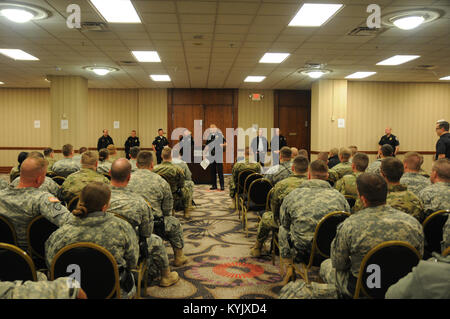 Kentucky National Guard soldiers assigned to the 223rd and 438th Military Police Companies receive their briefing during roll call to assist the Louisville Metropolitan Police Department in support of Thunder over Louisville, at the Galt House Hotel, April 22, 2017. (U.S. Army National Guard photo by Staff Sgt. Lerone Simmons) Stock Photo