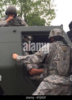 Maj. Gen. Edward Tonini, Kentucky's adjutant general, receives an orientation to the M142 High Mobility Rocket System prior to the HIMARS life fire at Camp Atterbury, Ind., July 21, 2015. (U.S. Army National Guard photo by Maj. Jimmie Warriner) Stock Photo