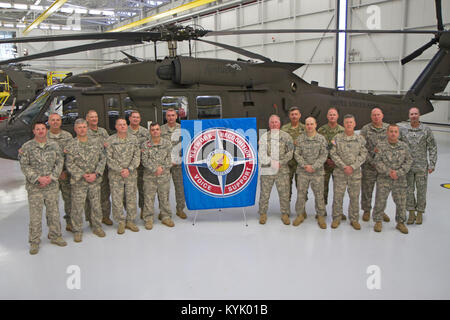 Fifteen members of the Kentucky National Guard's 63rd Theater Aviation Brigade have accumulated 4,000 military flight hours or more in their career. The Bluegrass Chapter of The Army Aviation Association of America has recognized these aviation Soldiers for their accomplishment.  Pictured from LEFT to RIGHT: Chief Warrant Officer 4 Porter Whitney, Chief Warrant Officer 4 John Boyle, Chief Warrant Officer 4 Eric Mattingly, Chief Warrant Officer 4 Tony Villier, Chief Warrant Officer 5 Steve Bowling, Command Chief Warrant Officer 5 Dean Stoops, Staff Sgt. Daryl Casey, Chief Warrant Officer 5 Haro Stock Photo