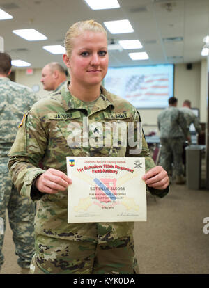 Kentucky Army National Guardsman, Sgt. Billie Jacobs, of Frankfort Kentucky, graduates from the Regional Training Institute on May 5 in Oklahoma City, as the first qualified female Fire Support Specialist (13F) in the United States Army. The four-week training gives Soldiers the ability to learn and utilize current technology where they will develop the confidence to support a maneuver element with surface to surface and air to surface fires while in combat. (Oklahoma National Guard photo by 1st Lt. Leanna Litsch/Released) Stock Photo