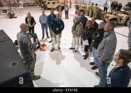 Master Sgt. Aaron Foote, services technician for the 123rd Force Support Squadron, explains to civilian employers the military duties of the unit’s Fatality Search and Recovery Team during an Employer Support of the Guard and Reserve “Bosslift” at the Kentucky Air National Guard Base in Louisville, Ky., Oct. 26, 2016. The Bosslift gave employers the opportunity to see what their employees do when they are serving as reservists in the Kentucky Air National Guard. (U.S. Air National Guard photo by Master Sgt. Phil Speck) Stock Photo