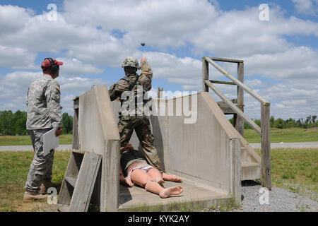 A competitor tosses a simulated grenade during the Region III Best Warrior Competition at the Wendell H. Ford Regional Training Center in Greenville, Ky., April 25, 2017. (U.S. Army National Guard photo by Sgt. Jenny Ewanchew) Stock Photo