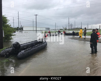 Kentucky Air National Guardsmen conduct water rescue missions in Port Arthur, Texas, Aug. 30, 2017, in the wake of Hurricane Harvey. The Airmen, assigned to the 123rd Special Tactics Squadron, are patrolling the area in motorboats, looking for people who are trapped in their homes or on rooftops because of the massive flooding. Once the residents are safely in the boats, the Airmen provide any necessary medical care and transport them to the nearest shelter. (U.S. Air National Guard photo) Stock Photo