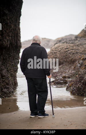 An old man with cane enjoying walk at one park in Beppu. Taken in Oita ...
