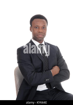 A portrait image of a serious handsome business man sitting with his arms crossed, looking into the camera, isolated for white background Stock Photo