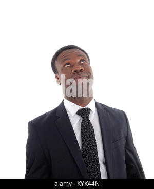 An African business man in a suit rolling his eye's up for frustration isolated for white background Stock Photo
