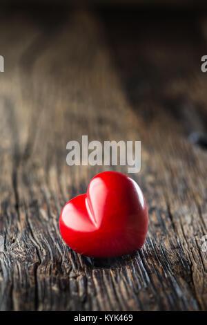 Valentines red heart. One two red heart on wooden table. Wedding or valentine day. Stock Photo