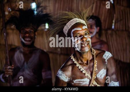 MAY 23, 2016: Portrait of a man from the tribe of Asmat people in the ritual face painting.  New Guinea Stock Photo