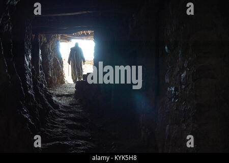 Berber man running walking houses in village, Atlas Mountains, Province Al Haouz, Morocco Stock Photo