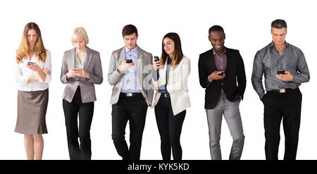Multi Ethnic Business People Using Cell Phones Against White Background Stock Photo