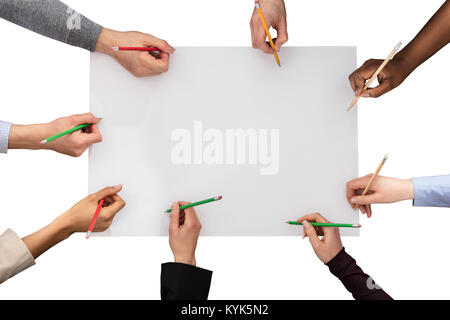 Elevated Of Hands With Pencil On White Paper Against White Background Stock Photo