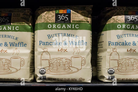 Packages of organic buttermilk pancake and waffle mix on a shelf at Whole Foods Supermarket, their own 365 brand Stock Photo