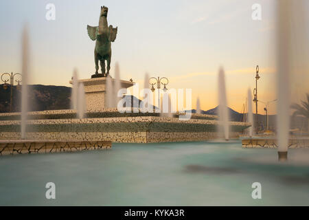 Corinth, Greece, 5 October 2017. Corinth in Greece central square with pegasus statue and the fountain. Stock Photo