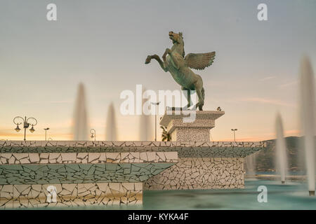 Corinth, Greece, 5 October 2017. Central square in Corinth with a fountain and the statue of Pegasus. Stock Photo