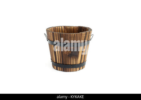 New handmade flowerpot out of dark brown wood on white background with lots of copy space. Stock Photo