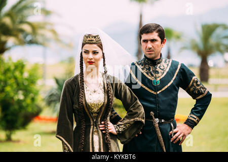 Batumi, Adjara, Georgia - May 26, 2016: Young couple of man and woman in Georgian national clothes in celebration of the national holiday - the Indepe Stock Photo