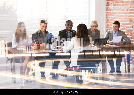 Multi Ethnic Businesspeople Having Meeting And Working In Modern Office Stock Photo