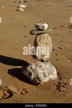 Rock sculpture on the beach. Stock Photo